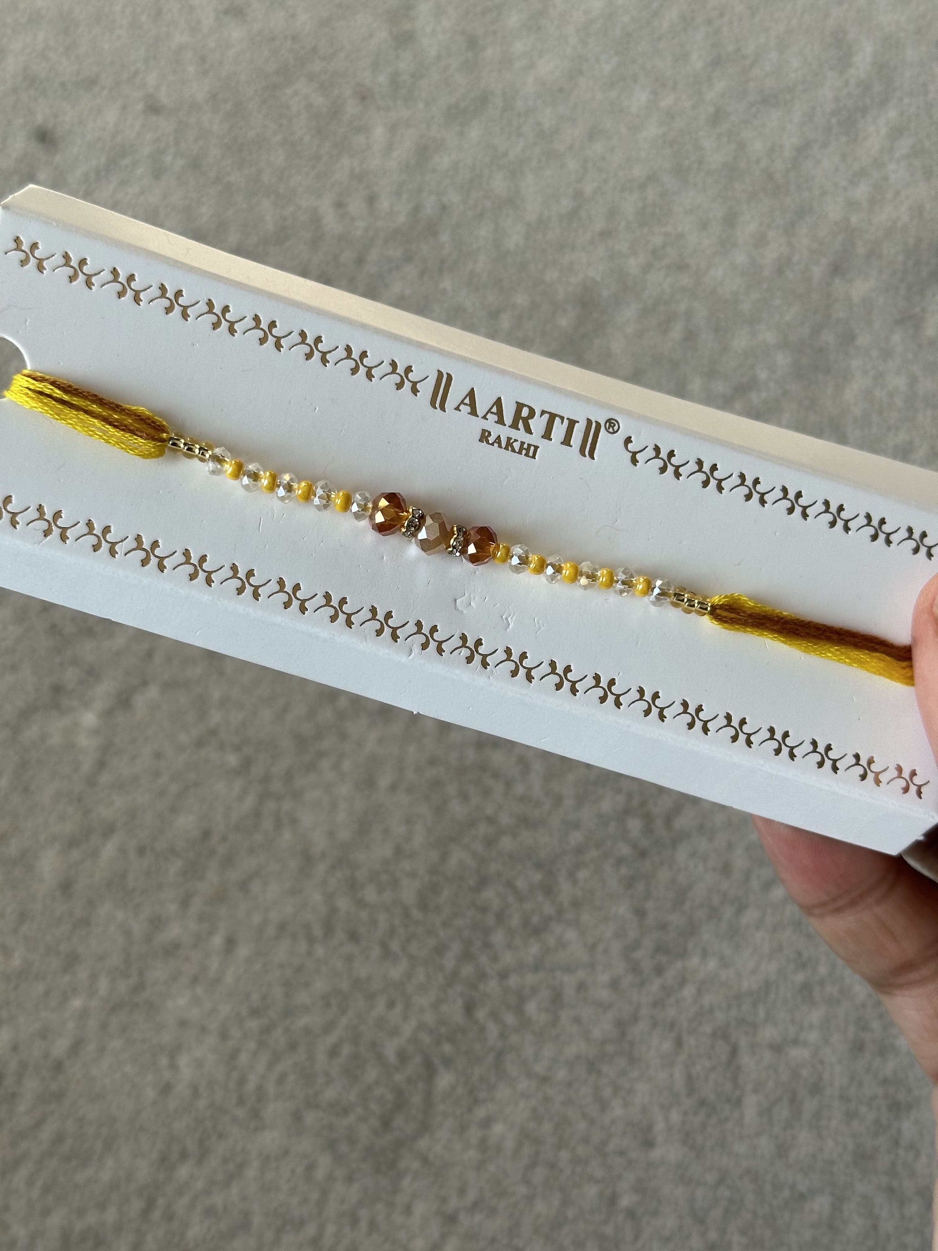 Yellow traditional Rakhi