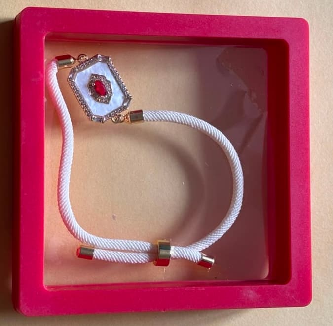 White Bracelet Rakhi with Ruby Stone